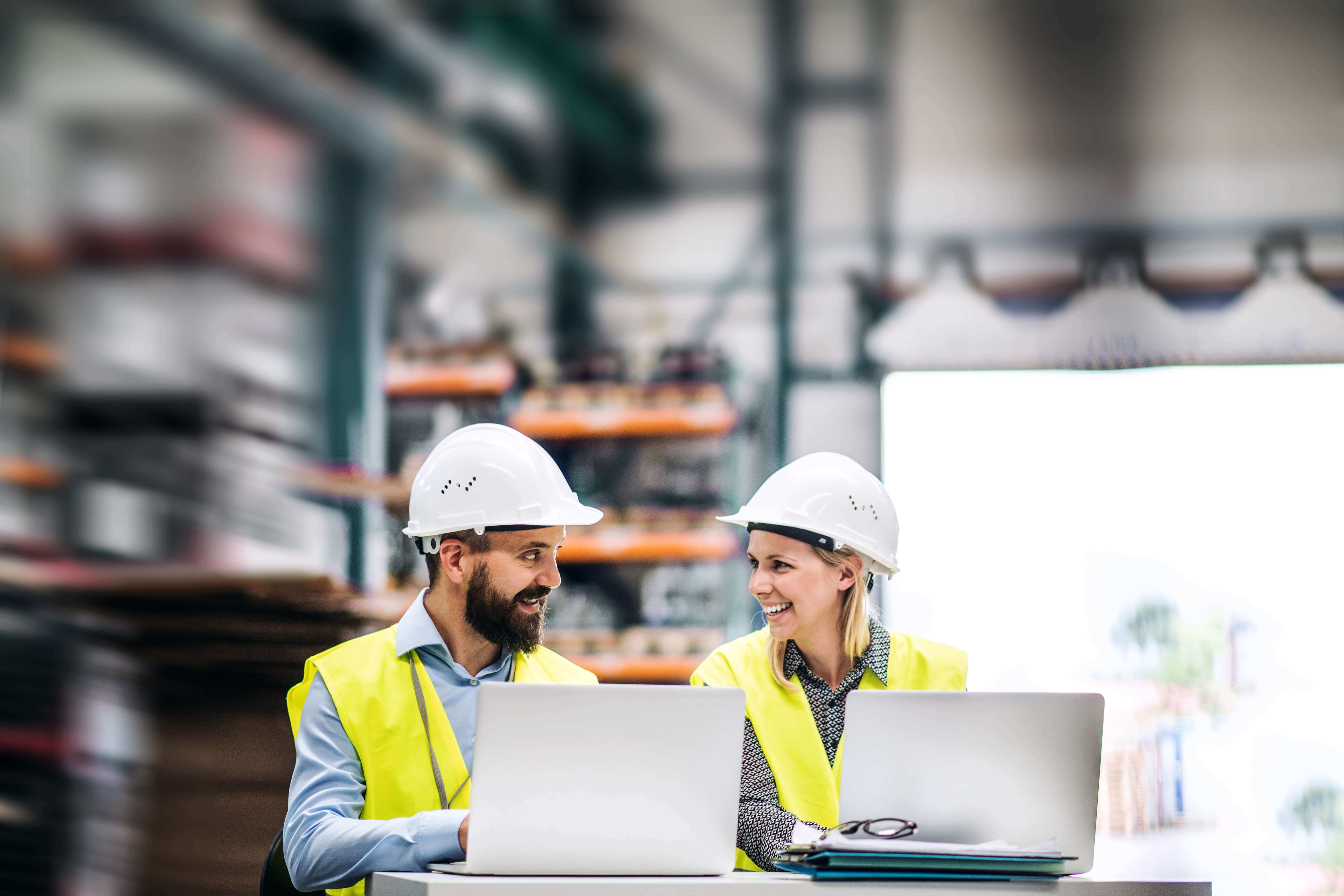 He to work at a factory. Man and women work Industrial. A man working in a Factory. Инженер женщина в кабинете за столом на заводе. Engineer with Laptop.